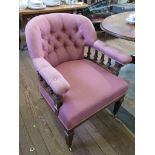 A late Victorian oak tub armchair, the button back on reeded square tapering supports on brass