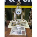 A 19th century French alabaster and giltmetal mantel clock, the drum case surmounted by birds, on