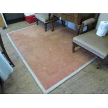 A contemporary 'Basin Street' design rug, in salmon pink with square pattern design 218cm x 168cm