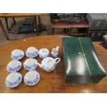 A Meissen blue and white tea service, with six cups and saucers, sugar bowl, milk jug and teapot, in