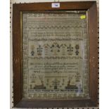 A Victorian woolwork sampler, by Susan Morris 1853, aged 14, with verse, flowers and stags in a