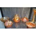 A collection of carnival glass, all amber with lustre finish including three vases lidded dishes,