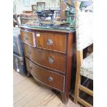 A George III style mahogany serpentine chest of drawers, with two short and two long drawers on