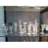 A collection of 19th century Edwardian drinking glasses, including a set of three faceted trumpet