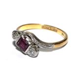 A ruby and diamond ring set in 18 carat gold
