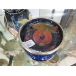 A Moorcroft Pottery Pomegranate and grape pattern dish with EPNS rim 12.5cm diameter