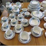 A Midwinter Spanish Garden pattern dinner service including two teapots, coffee pot, teawares and