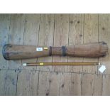 An African drum, tapering to the centre, 68cm high and a Chinese bamboo flute (2)