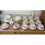 An Edwardian part tea service, with gilded purple floral decoration (39 pieces)