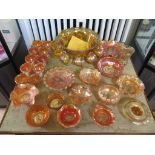 A collection of carnival glass, all amber with lustre finish including punch bowl and twelve cups,