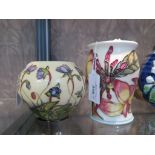 A Moorcroft pottery Hipatica pattern vase 10.5cm high and a Frangipani vase 13.5cm high (2)