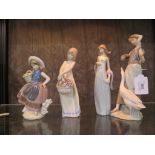 Four Lladro figures, including two of girls holding baskets, one in an evening gown and another with