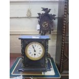 A Swiss cuckoo clock and a Victorian slate mantel timepiece with enamelled dial (2)
