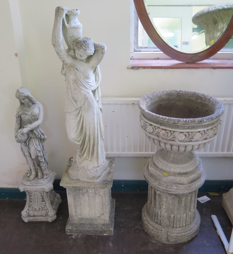 A Classical style garden figure of a maiden holding an urn, on a plinth base, another garden