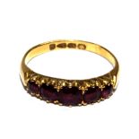 A five stone ruby ring set in 18 carat gold