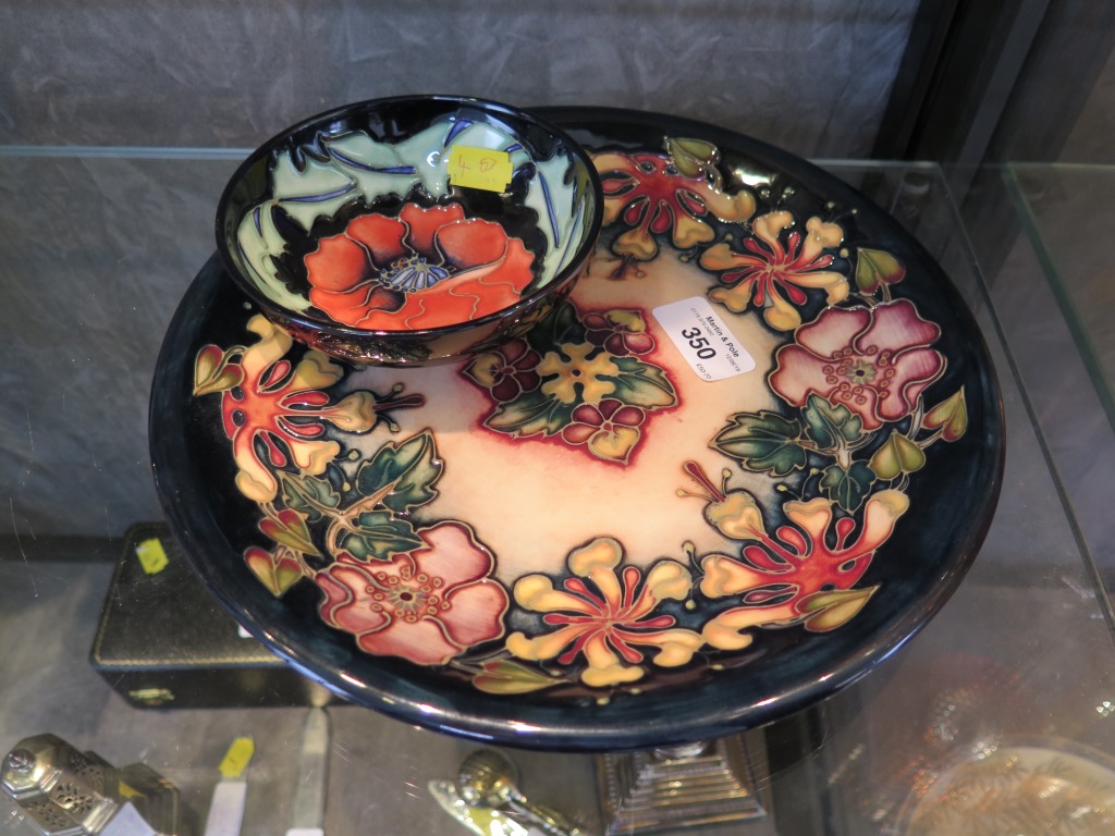 A Moorcroft Pottery Oberon pattern charger 26cm diameter and a poppy design dish 12cm diameter (2)