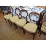 A set of six Victorian balloon back salon chairs, with carved mid rails, stuffover seats and moulded
