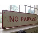 A metal red and white No Parking sign 111cm x 30cm
