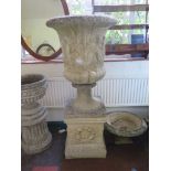 A large Classical style campana shape garden urn, with wreath design plinth 139cm high