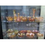 A collection of carnival glass, all amber with lustre finish, including bowls, dishes and vases