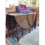 An 18th century oak gateleg table, the oval top over a frieze drawer on turned and block legs and