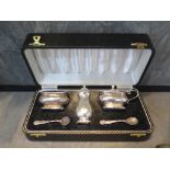 A silver cruet set in presentation case