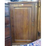 A 19th century oak corner cupboard, with panelled door, 77cm x 109cm