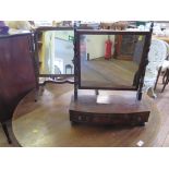 A 19th century mahogany toilet mirror, with turned supports on a bowfront base with three drawers on