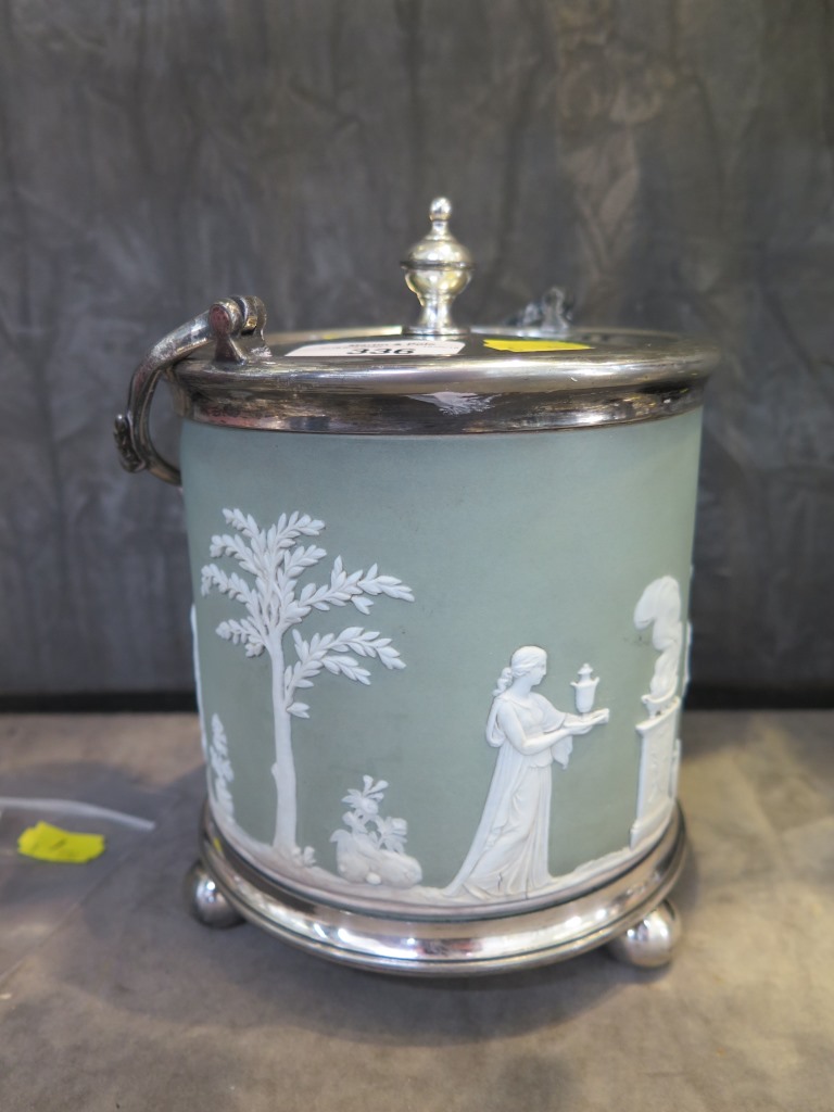 A Wedgwood Jasperware biscuit barrel, with EP metal mounts, cylindrical depicting Classical