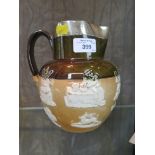A large Doulton stoneware harvest jug with a silver rim