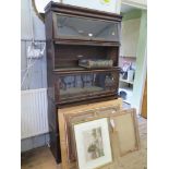 A Globe Wernicke oak bookcase, the moulded top over five graduated sections with glazed fronts,