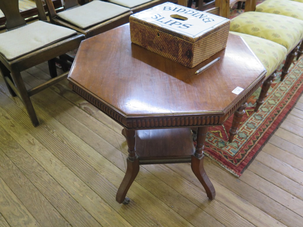 An Edwardian walnut occasional table, the octagonal top with lobed edge, on ring turned supports