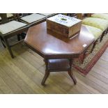 An Edwardian walnut occasional table, the octagonal top with lobed edge, on ring turned supports