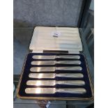 A cased set of six tea knives with silver handles