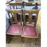 A set of four beech dining chairs, with solid rails and splats, leatherette seats and turned legs