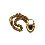 A gold colour metal Victorian bracelet with gold colour metal padlock having cabochon garnet