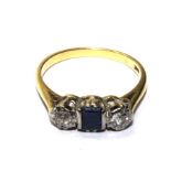 A three stone sapphire and diamond ring set in 18 carat gold