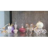 A Caithness glass scent bottle, a Murano glass scent bottle, four others and a glass carriage pulled