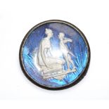 A silver mounted butterfly wing brooch with lady and putti to front