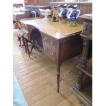 An early 19th century mahogany and boxwood strung lady's writing table, with inverted bowfront top