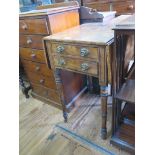 A Regency mahogany and ebony strung Pembroke table, with two frieze drawers on ring turned legs