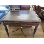 A mid Victorian mahogany library table, the inset top over two frieze drawers on octagonal legs with