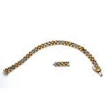 An 18 carat gold and diamond set bracelet