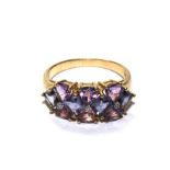 A 9 carat gold ring set with diamonds and amethyst