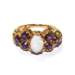 A 9 carat gold dress ring set with opal and amethyst