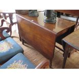 An Edwardian mahogany drop leaf table, the rectangular top with rounded corners on square tapering