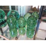 Six green glass dumps, with air bubbles, largest 12cm high