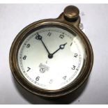 A Smiths car clock with silvered dial and winding knob, 9cm diameter