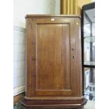 A 19th century oak corner cupboard, with panelled door, 77cm x 109cm