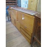 A 1970s teak fall front secretare wall unit, another as a drinks cabinet, 91.5cm wide, 33cm deep,